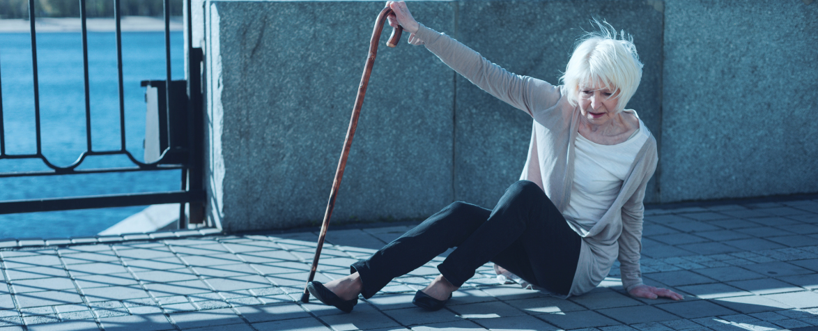 Elderly woman falling walking on footpath